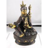 A cold painted bronze figure, with calligraphy to reverse 10.5cm high