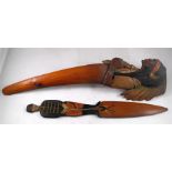 An Anri novelty page turner the handle carved as an North American Indian wearing a feather head