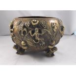 A Chinese censer decorated with Lizards, birds and fruit standing on stylised frog feet with