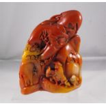 A chinese carved soapstone boulder, figures in a rocky landscape 12cm high