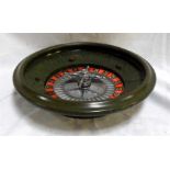 An early 20thC green mottled bakelite roulette wheel 36cm diameter