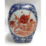 A large Chinese jar and cover of ovoid rectangular form, decorated birds and flowers within panels