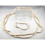 An Art Deco ivory bead necklace and matching bracelet with yellow metal clasp