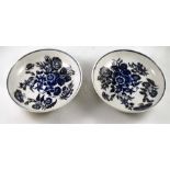 A pair of 18thC Doctor Wall period Worcester tea saucers, three flower pattern, blue crescent mark