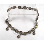 A Chinese silver gilt necklace each link marked with a chinese character 39cm long