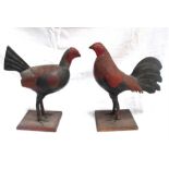 A pair of 19thC folk art game poultry (chickens) carved and painted wood with glass eyes standing on