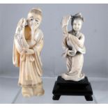 An early 20thC Chinese Ivory figure, a robed woman holding a fan 7.5cm high and another similar, a