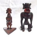 Two unusual carved wooden tribal figures in the form of demons 17cm and 13 cm high (2)