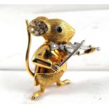 A fine 18ct gold brooch modelled as a mouse violinist set with 10 diamonds, 2 ruby buttons and