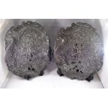 A pair of 19thC Rococo pattern pewter dishes decorated cherubs and flowers 21cm x 25cm