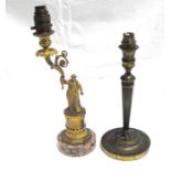 A Figural brass table lamp standing on a pink granite base and a brass table lamp (2)
