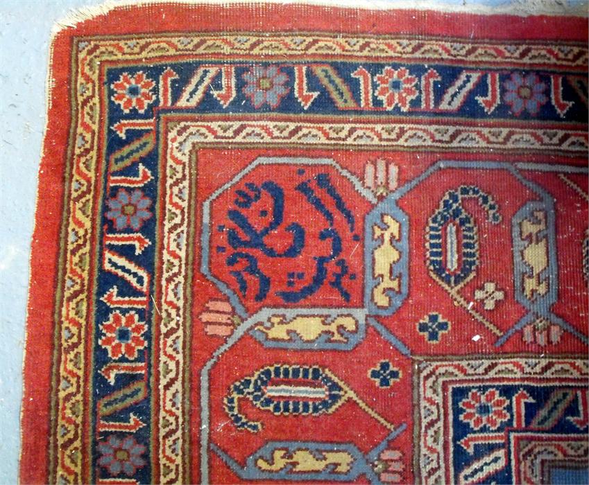 A large Persian floor carpet decorated stylised flowers on a red ground 354cm x 453cm (wear) - Image 6 of 9