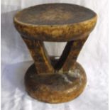 An African head rest of small proportions with chip carved decorations 15cm high