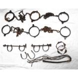 A set of three chain linked slave neck shackles locking with a T bar key another set similar, two