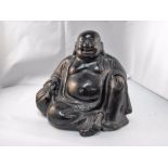 A Chinese glazed pottery figure, a seated Hotei Buddha