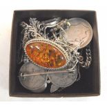 A Silver mounted amber brooch, a silver locket and other silver items