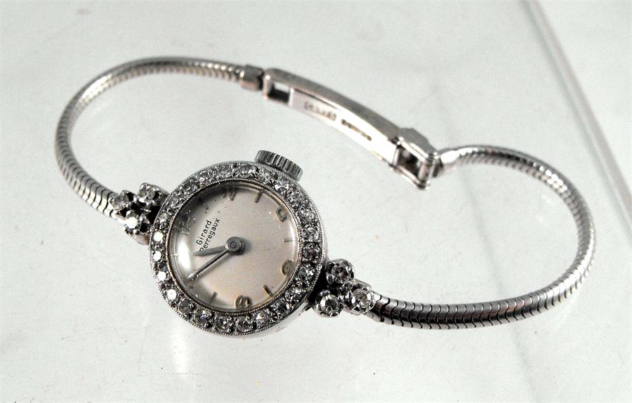 A Girard-Perregaux 18ct white gold and diamond set ladies cocktail watch, the dial with baton