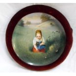 A 19thC Vienna charger, decorated a young girl picking flowers 33cm diameter