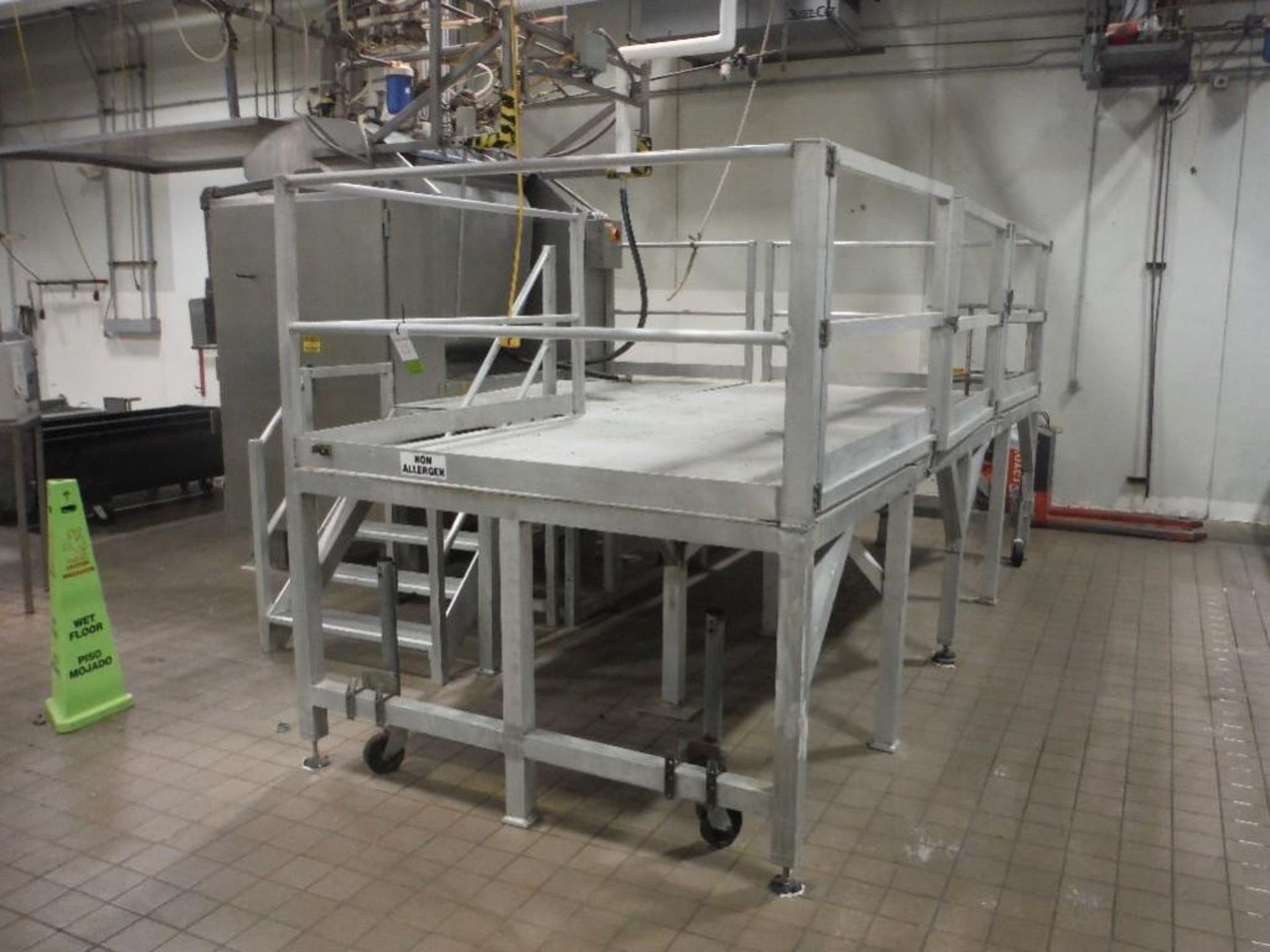 Aluminum work mezzanine 16 ft. long x 6 ft. wide, with work gate, hand rails, with 5 step platform,