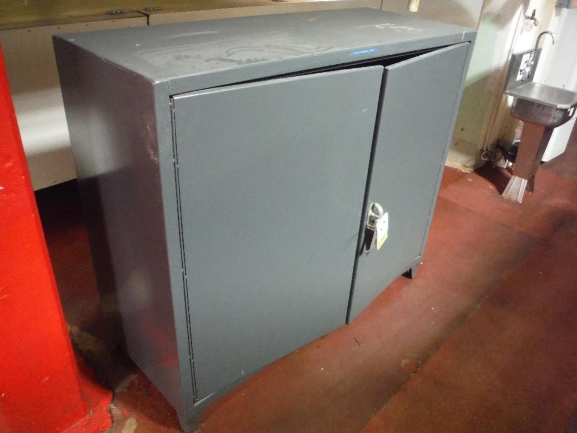 Steel cabinet and contents 60 in. wide x 24 in. deep x 52 in. tall, and mild steel cabinet 60 in. x