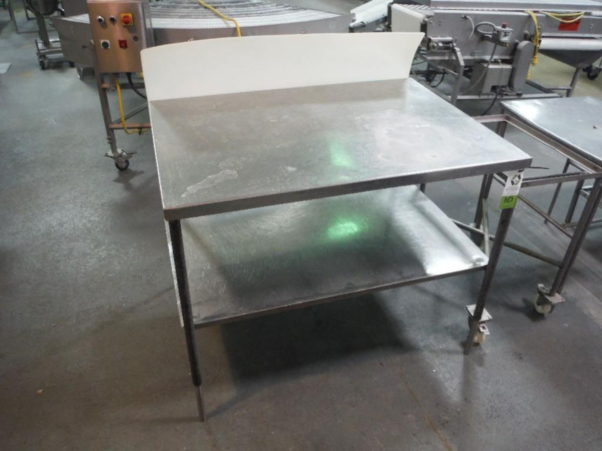 SS table, mild steel legs, 48 in. long x 36 in. wide x 38 in. tall, **(Located in: Marshall, MN)** R