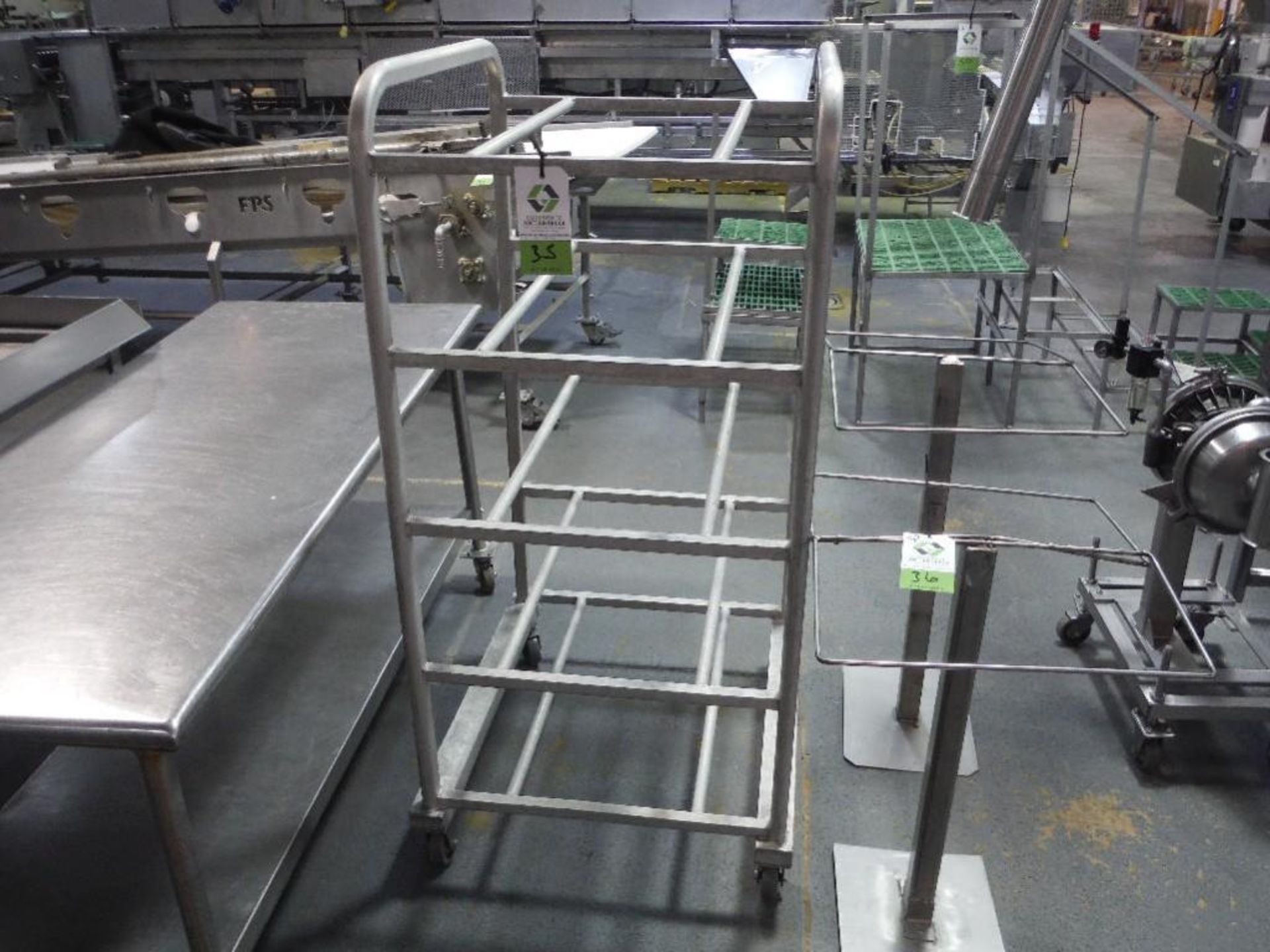 Aluminum rack, 32 in. long x 26 in. wide x 60 in. tall, on wheels, **(Located in: Marshall, MN)** Ri