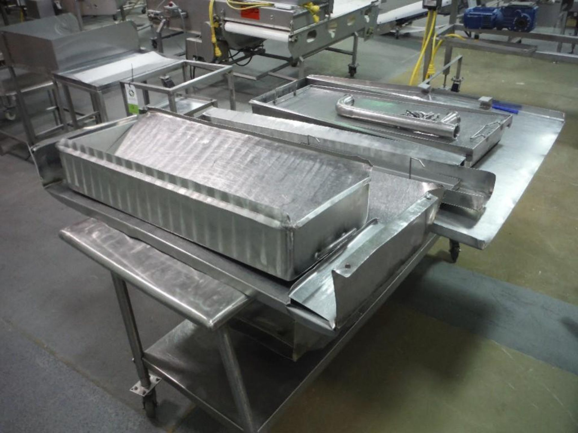 SS table 64 in. long x 28 in. wide x 32 in. tall, on wheels, with misc SS pans and covers, **(Locate - Image 3 of 3