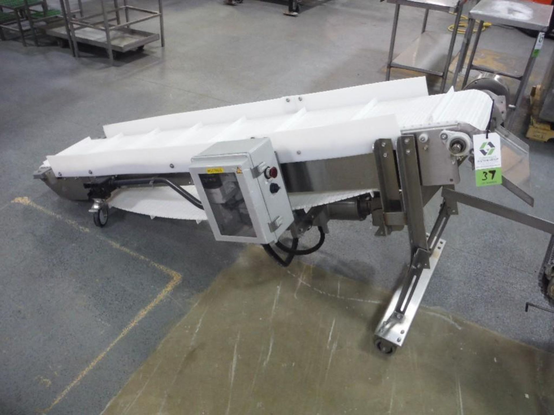 SS flighted incline conveyor, 90 in. long x 14 in. wide x 8 in. infeed x 38 in. discharge, SS clad m