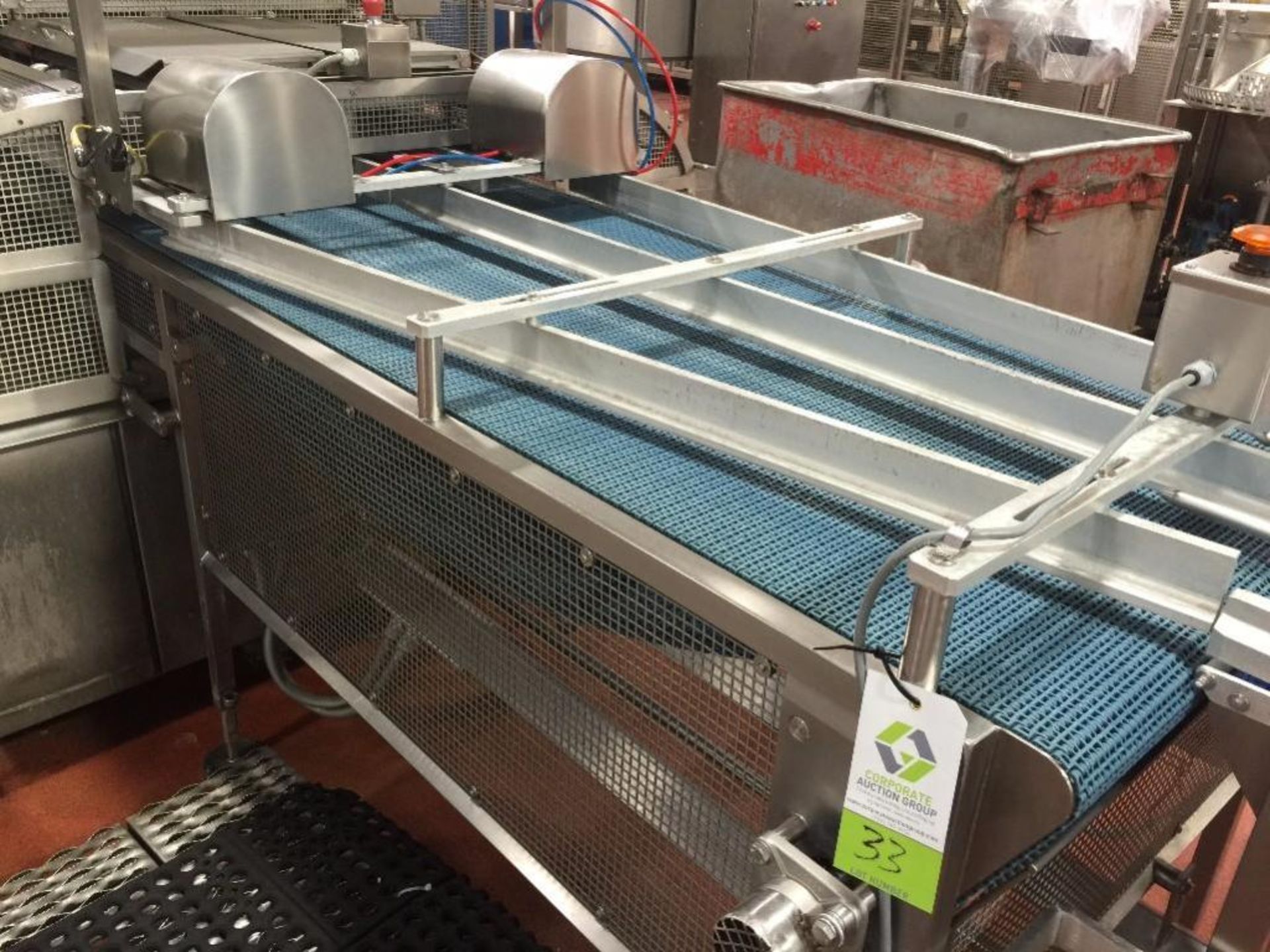 SS conveyor out of Mondini, 4 lane to 2 lane diverter, 35 in wide x 112 in long, blue plastic belt.