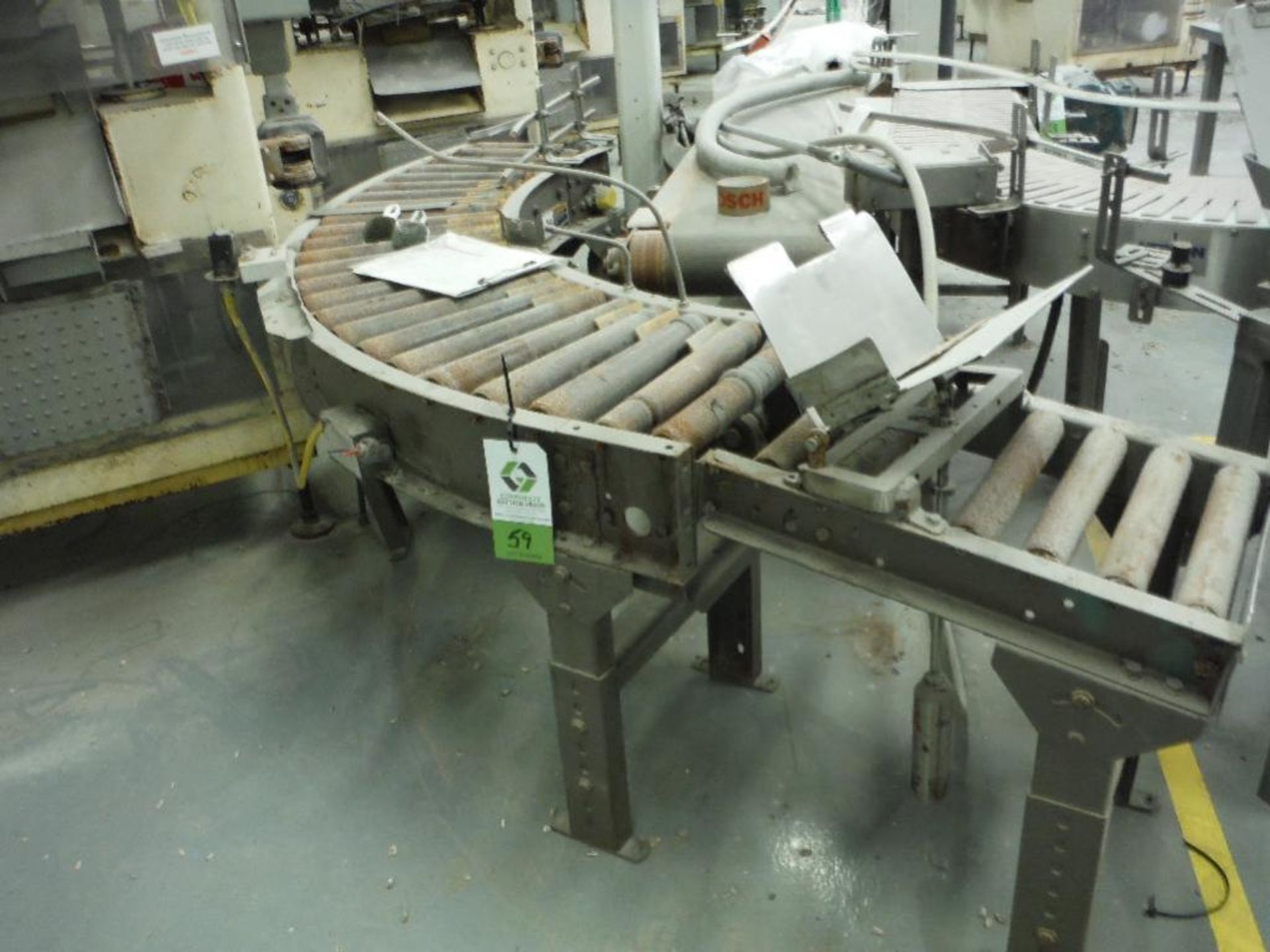 Mild steel 90 degree power roller conveyor, 60 in. x 60 in., 15 in. rollers. Rigging Fee: $100