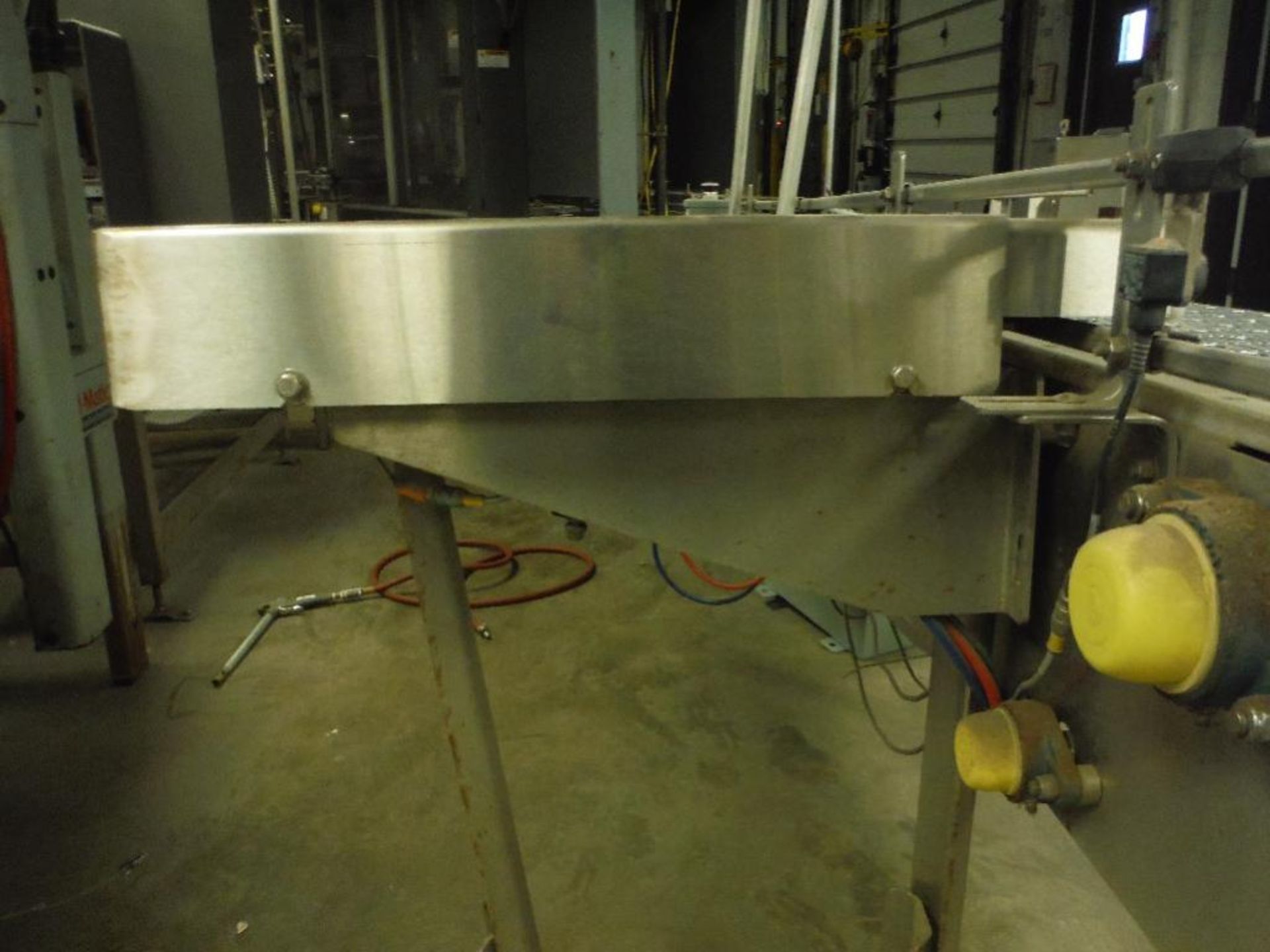 SS infeed conveyor, 102 in. x 12 in., w/ drive and reject ram. Rigging Fee: $150 - Image 10 of 10