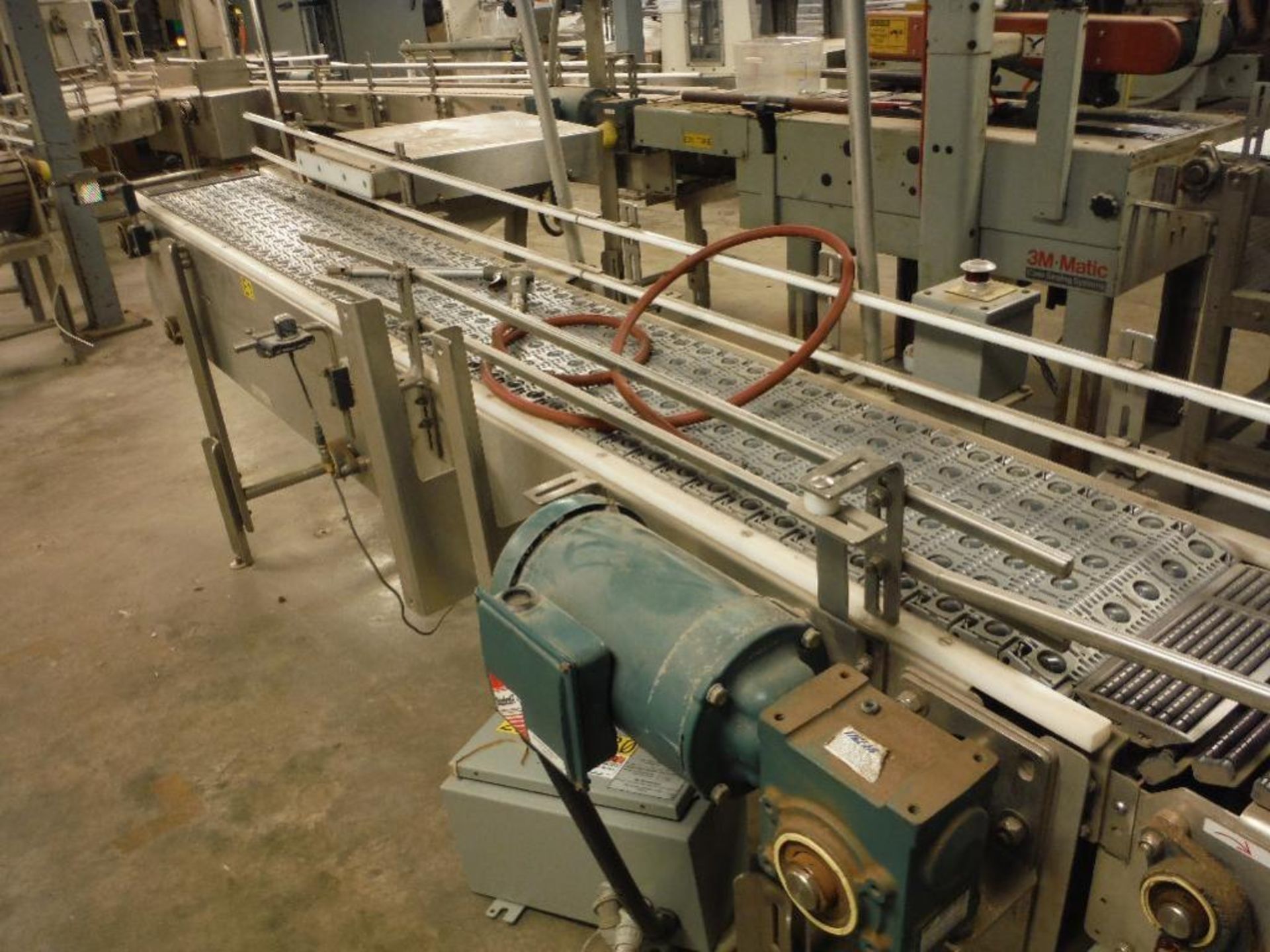 SS infeed conveyor, 102 in. x 12 in., w/ drive and reject ram. Rigging Fee: $150 - Image 2 of 10