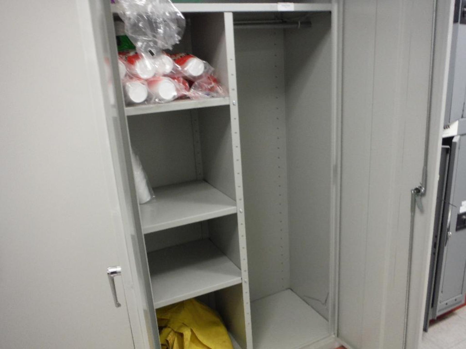(2) 2 door cabinets and a shelf, flashlights, batteries, and emergency drinking water packets. Riggi - Image 9 of 9
