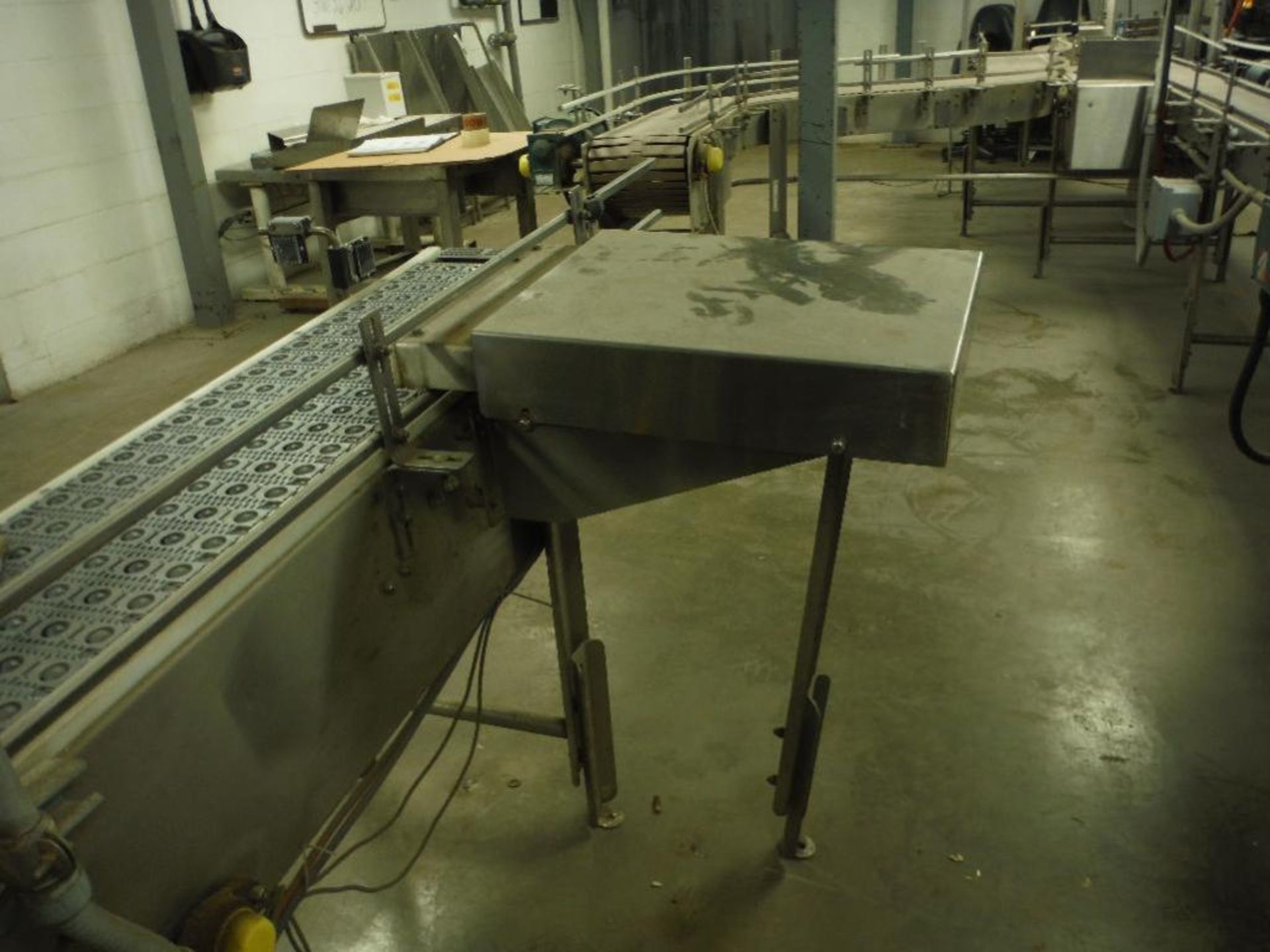 SS infeed conveyor, 102 in. x 12 in., w/ drive and reject ram. Rigging Fee: $150 - Image 5 of 10