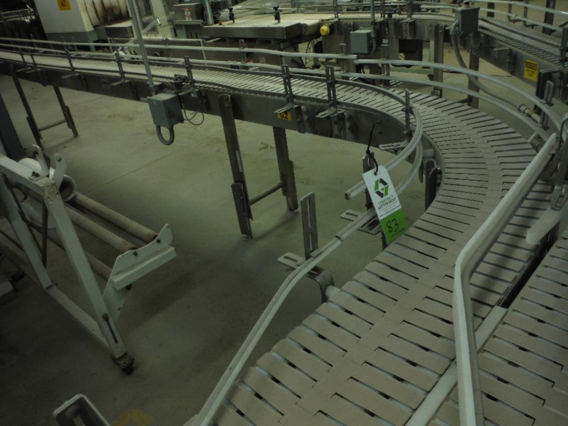 Nercon SS 180 degree conveyor, U-shape 40 ft. x 10 in. table top chain, w/ motor and drive. Rigging