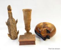A large collection of wooden carved items to include biplane, boat,