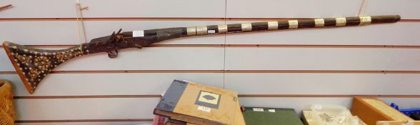 Persian flintlock gun, 54" long  Live Bidding: Lock and arm loose, flint striker missing, repaired