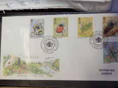 Five albums and quantity of loose First Day Covers together with small tin of loose stamps