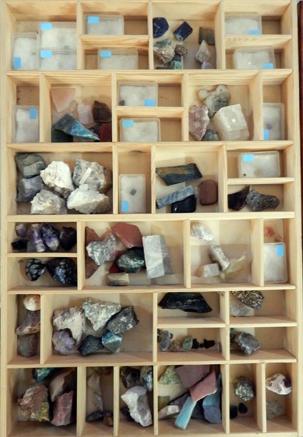 A collection of geological specimens to include natural and polished stones such as pink quartz and
