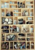 A collection of geological specimens to include natural and polished stones such as pink quartz and