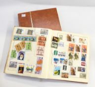 Orange stockbook with mainly GB mint and used stamps and Strand album with world stamps (2)