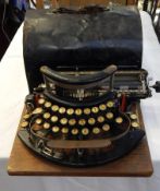 An Imperial typewriter with black metal case