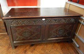 18th century oak coffer, the two plank top above a lunette carved frieze,