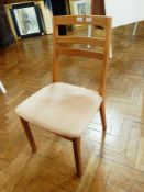 A set of six Nathan Furniture ladder back dining chairs with stuffover upholstered seats on square