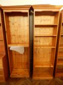 Pair of modern pine open bookcases with five adjustable shelves, on plinth base,