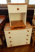 Modern white chest of four drawers with wooden knob handles,