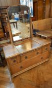 Oak dressing table with mirror, two flanking short drawers and two long graduated drawers,