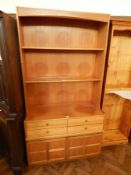 Contemporary Nathan Furniture dresser with two shelf open rack, four frieze drawers,