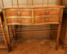Reproduction yew wood veneer serpentine front chest of four short drawers,