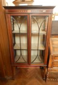 Edwardian mahogany china display cabinet having raised ledge back,